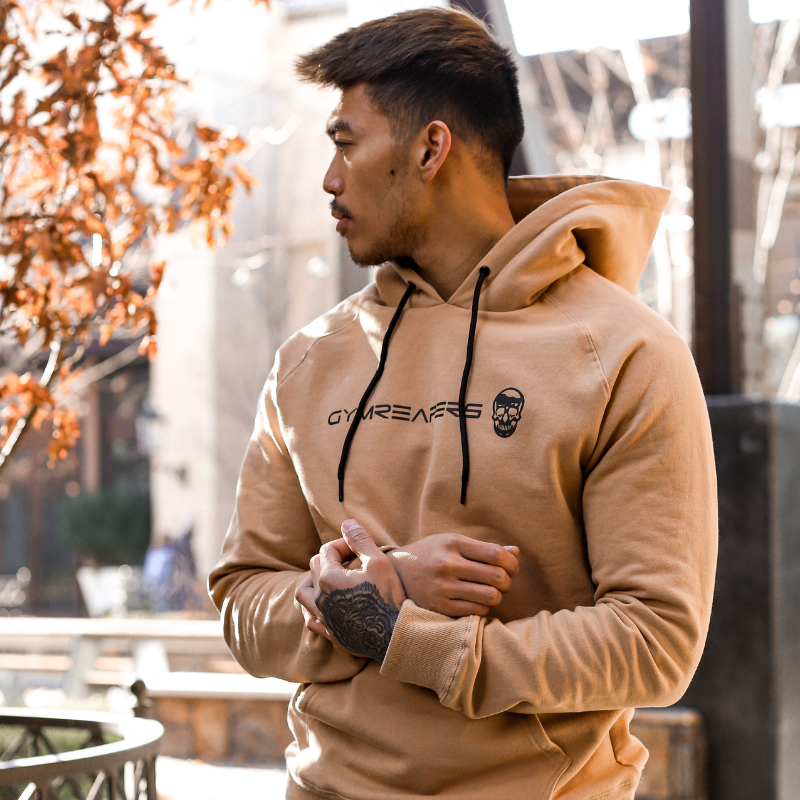 Gymreapers hoodie in sand color being worn